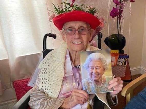 Alice Rodgers with her card from the Queen