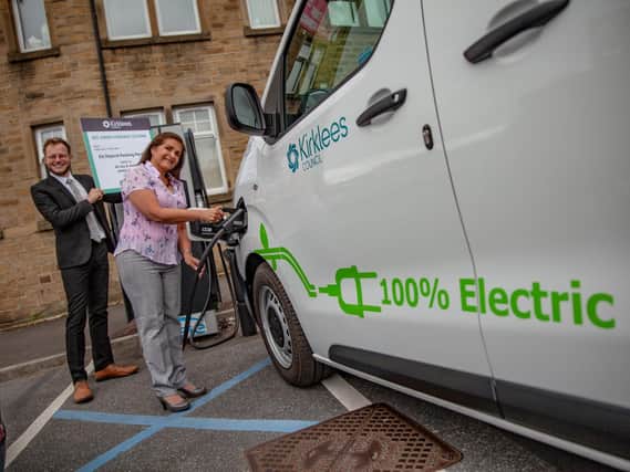 Coun Simpson and Coun Mather at an electric vehicle parking space/charging point in Huddersfield