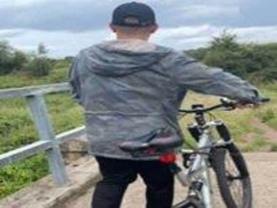 Police have issued this photo of a man they are looking to trace in connection with assaults on two girls on the River Calder in Dewsbury