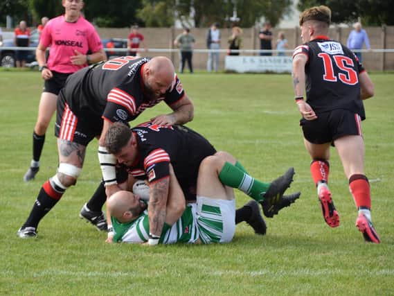 All wrapped up as this Dewsbury Celtic player is grounded in the game against Normanton Knights. Picture: Rob Hare