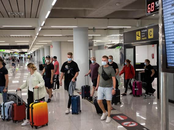 MASK WEARING: Mandatory in the airport and on the plane. Photo: Getty Images