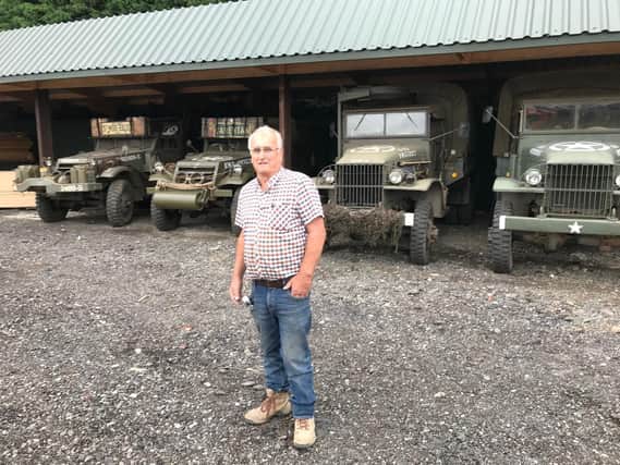 Howard Cook with some of the military vehicles