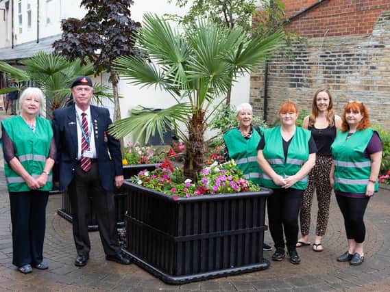 The Cleckheaton in Bloom team pictured with their handiwork in the Precinct
