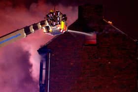 Firefighters tackle a blaze at a house on Prospect View, off Pinfold Hill, Dewsbury in February 2013