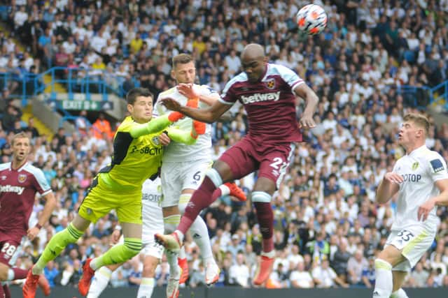 Leeds United goalkeeper Illan Meslier challenges for a high ball.