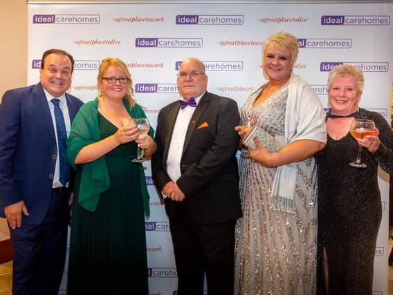 Gary Kent, manager of Lydgate Lodge care home in Batley, centre, with members of his team and awards host Shaun Williamson, left
