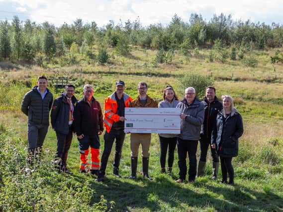 The Dewsbury Country Park team has received a £1,000 donation from UK Greetings, which is based in the town, to enable more trees to be planted at the site