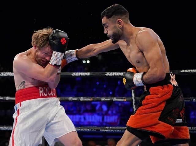 Amaar Akbar lands a punch on his way to victory.
