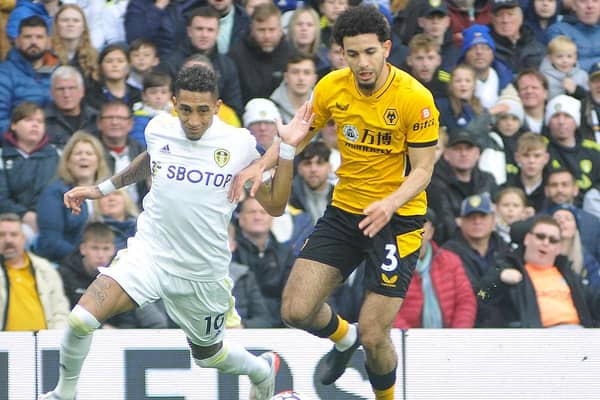 Raphinha takes on Wolves defender Rayan Ait-Nouri before limping off with a leg injury after being the victim of a bad tackle.