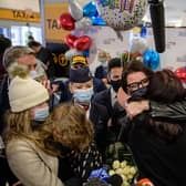 JFK AIRPORT: Families reunite in New York after the travel ban to the USA was lifted this week. Photo: Getty Images