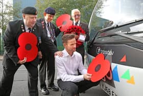 Team Pennine buses in Calderdale and Kirklees are being adorned with poppies to support the annual Poppy Appeal, as the nation prepares to remember the fallen. From left, veterans Geoff Lister, Michael Scott and Keith Webster watch as engineer Jonathan Ruston fits a poppy to one of the company’s buses