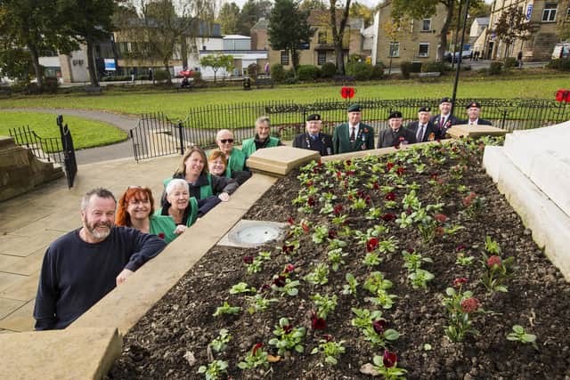 Pictured in Cleckheaton Memorial Park are, from the left, Richard Holbrook from Kirklees Council's Parks and Open Spaces team; Cleckheaton in Bloom members Nichola Garland, Janet McGenn, Kimberley Parry, Janeann Sharp, Mick Shaw and John Davis; with members of the Spenborough branch of the Royal British Legion, Cliff Frear, Conrad Russell, Eddie Morton, David Durrans, Paul Bird and Alan Serjeant