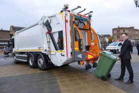 Councillor Will Simpson with an electric refuse collection vehicle