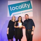 Julie McDowell and Vina Randhawa from Kirklees Council collecting the award from Tony Armstrong, Chief Executive of Locality. © Alex Brenner