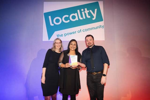 Julie McDowell and Vina Randhawa from Kirklees Council collecting the award from Tony Armstrong, Chief Executive of Locality. © Alex Brenner
