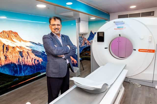 Dr Khalid Naeem, Batley GP and chair of Kirklees CCG, inside the mobile CT scanner at the Tesco car park in Batley
