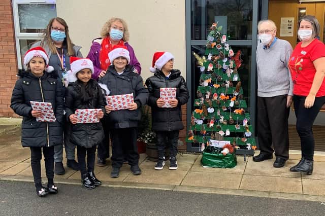 Pictured on the left are Boothroyd Primary Academy teachers Mandi Reeve and Pam Goddard with children from the forest skills group. And on the right are Ashworth Grange resident, Bill Atkinson, and activities co-ordinator, Colette Senior