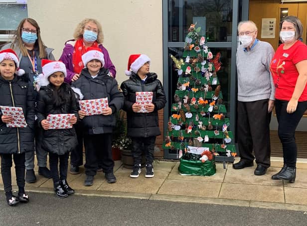 Pictured on the left are Boothroyd Primary Academy teachers Mandi Reeve and Pam Goddard with children from the forest skills group. And on the right are Ashworth Grange resident, Bill Atkinson, and activities co-ordinator, Colette Senior