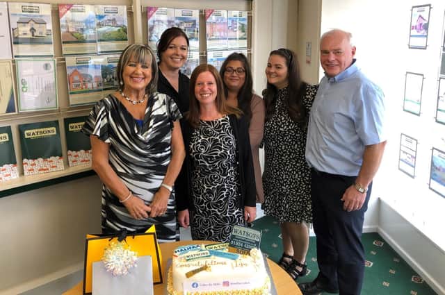 Staff at Watsons Property Services in Birstall held a special presentation for Lyn Toussaint