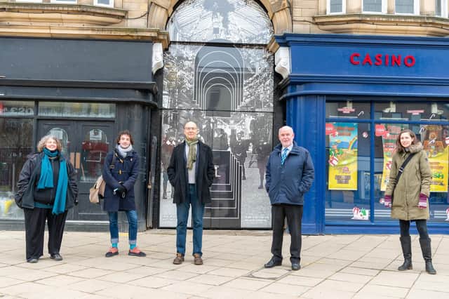 Pictured from the left are Kelly O'Reilly, Aidan D'Abet, Chris Hill (Dewsbury Arcade project manager), Coun Eric Firth (cabinet member for town centres) and Frances Smith (principal consultant at Beam) by the new temporary artwork at The Arcade in Dewsbury