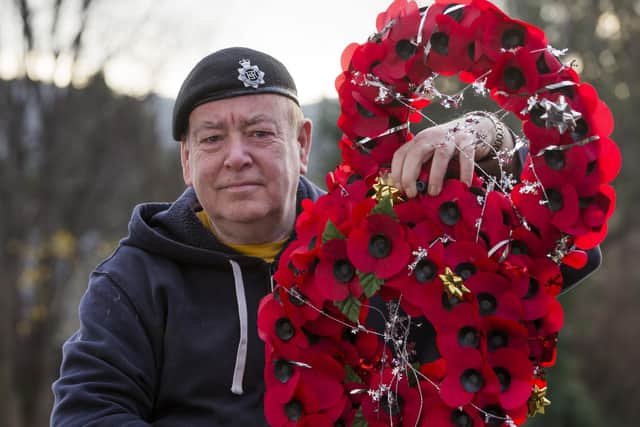 Tim Wood with his 'Christmas in the trenches behind the wire' wreaths