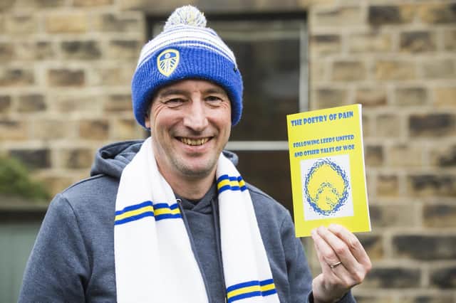 Lifelong Leeds United fan Mike Keddie, a teacher in Dewsbury, with his book The Poetry of Pain
