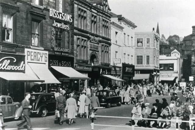 Dewsbury during the 1950s when people had time to sit and watch the world go by. Not one of the shops pictured on Market Place are with us today.