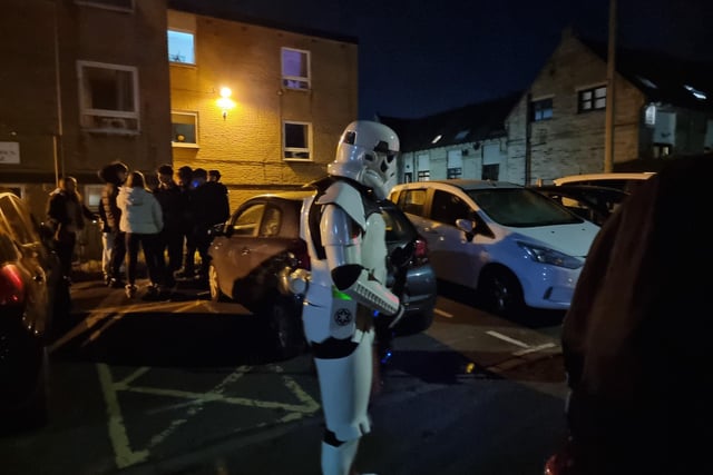 Characters from Star Wars entertained children and families on the packed streets.