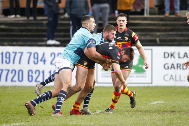 Bailey O'Connor is tackled in the friendly defeat at Fev.