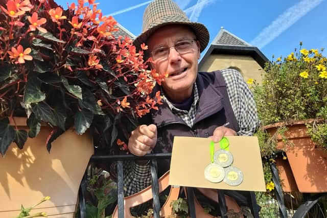 Cleckheaton gardener Pete Fawcett with the three gold medals.