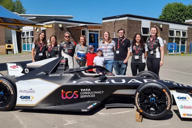 The Jaguar TCS Racing team, including Sam Bird and Lais Campelo, the team's Software and Data Engineer, along with Ava and her family, and Crowlees headteacher Kathy Woods.