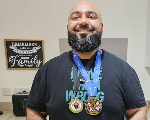 Dewsbury Moor's Imran Khan with the two gold medals he won at the recent British Powerlifting Championships.