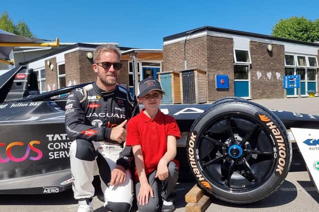 Jaguar TCS Racing driver Sam Bird with Crowlees Junior and Infants School pupil Ava Beal, who wrote to the Team Principal suggesting air conditioning was inserted into the drivers’ helmets to help keep them cool while racing. The team responded with an exciting visit to the Mirfield school.