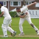 James Glynn bowls for Townville in their win over Premier Division leaders Woodlands. Photo by Scott Merrylees
