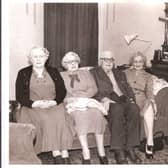 This is just one of the many pictures Muriel took of her parents and uncle and aunts. This one was taken at the family home in West Park Street. Her dad is pictured with Muriel's mother on his right.