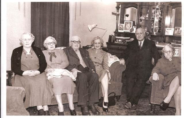 This is just one of the many pictures Muriel took of her parents and uncle and aunts. This one was taken at the family home in West Park Street. Her dad is pictured with Muriel's mother on his right.