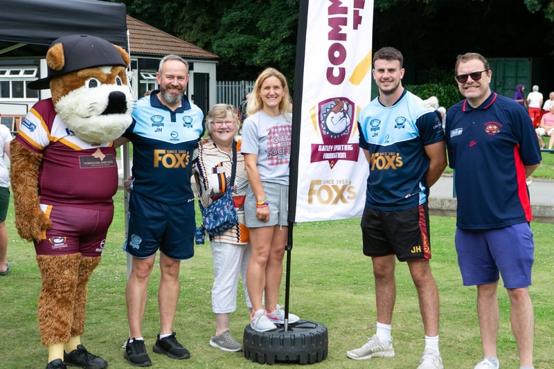 MP Kim Leadbeater, with Batley Bulldogs player Josh Hudson and the community support team at the Great Health and Wellbeing Get Together, Wilton Park, Batley