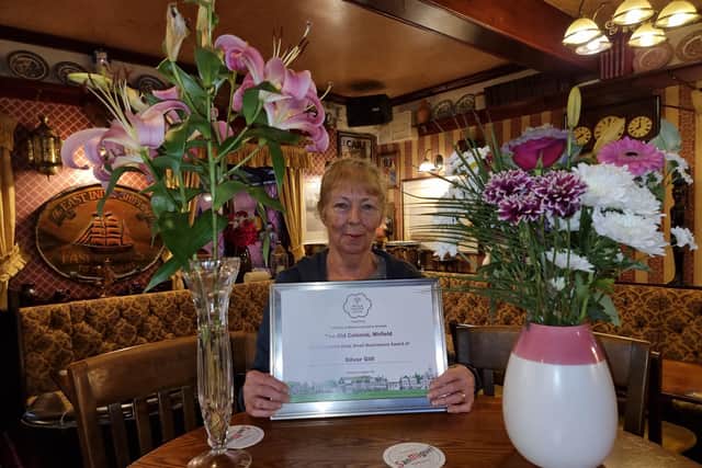 Publican Carol Wood, of the Old Colonial, Mirfield, with the 2022 Yorkshire Rose Small Businesses Silver Gilt award from Yorkshire in Bloom