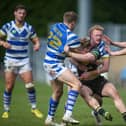 Lachlan Walmsley, scorer of two more tries for Halifax Panthers, helps Jake Maizen to tackle a York player in the 16-6 win.