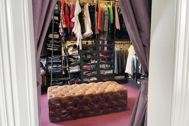 One bedroom is currently used as a walk-in dressing room, with bespoke fitted storage.