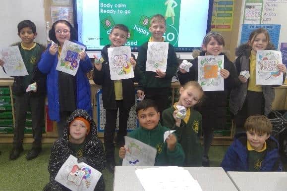 Pupils from Windmill Primary School with the pictures they created.