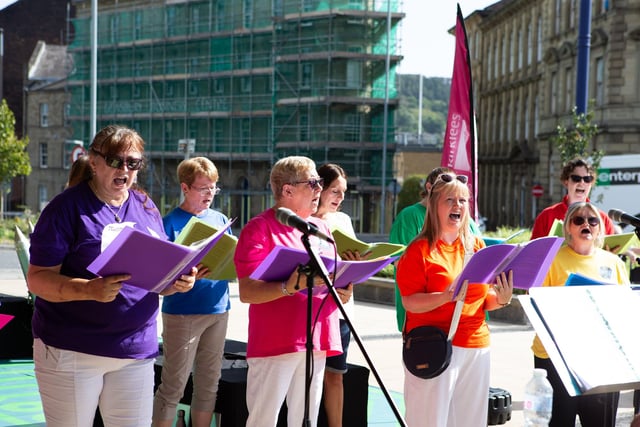 Dewsbury Community Choir performing at Dewsbury Train Station.