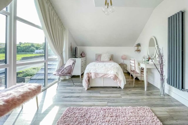 Another bright and appealing bedroom with open country views.