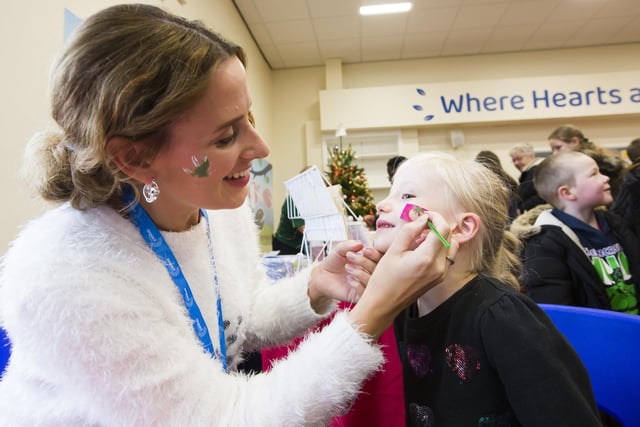 Kerrie Thompson paints six-year-old Summer McKay's face at Mirfield Winter Fair.