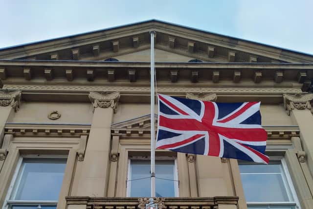 Flag flying half-mast outside Batley Town Hall.