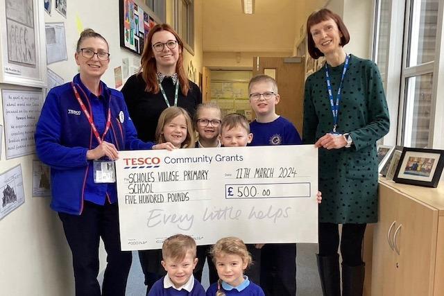 £500 was presented to Scholes Village Primary School who are planning for a climbing wall and a sensory garden.
