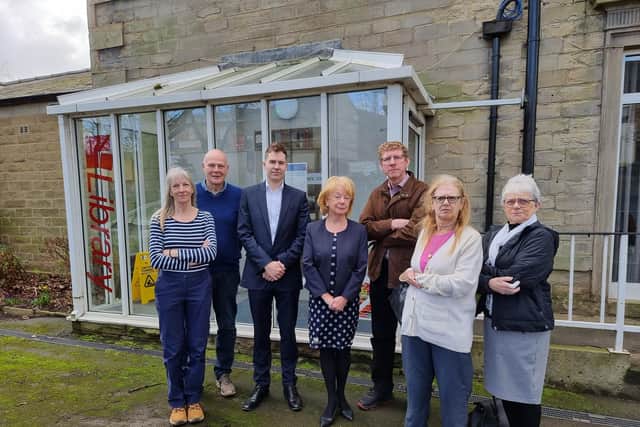 The Friends of Mirfield Library group, led by chair Cynthia Collinson (centre). Also pictured are Coun Adam Gregg (third from left) and Coun Martyn Bolt (third from right).