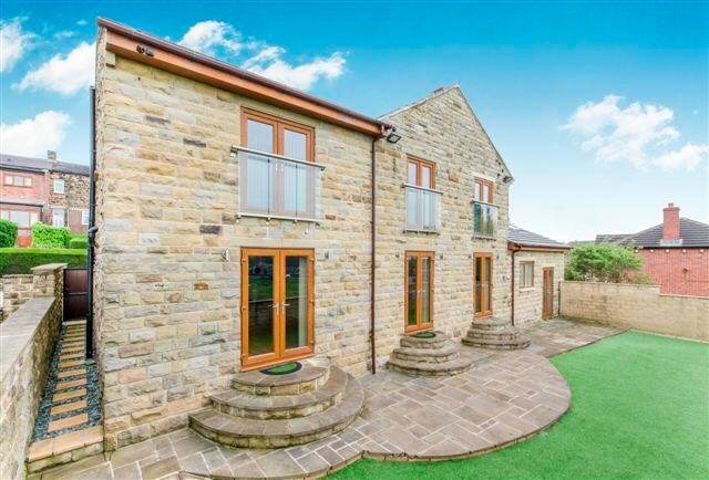 This property on Jail Road, White Lee, Batley, is on sale with Wilcock for offers over £600,000