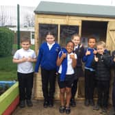 Children at Fieldhead Primary School in Batley with their new outdoor reading shed