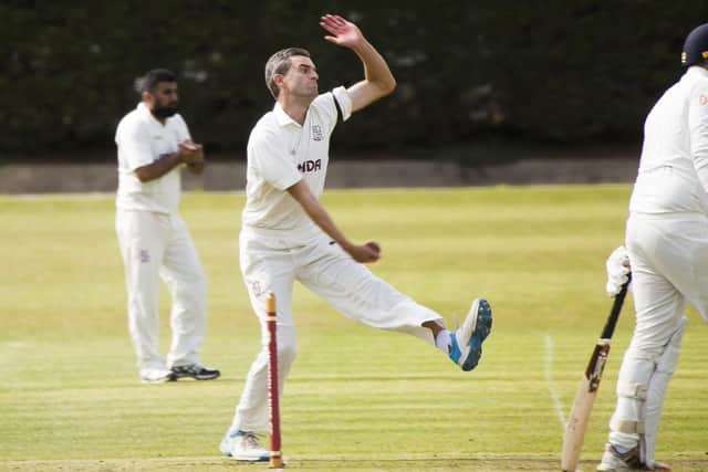 Brad Schmulian took five wickets for Woodlands against Ossett to help his side to the top of the Bradford League.